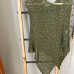 Hunter green shawl over head. Sits on shoulders.